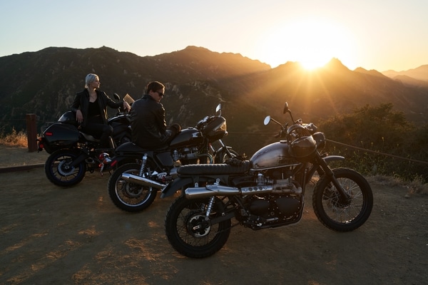Group of motorcycles sitting on a lookout during sunset