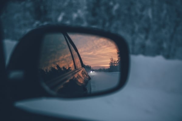 View of a car from the side mirror