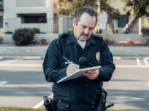 Cop writing a speeding ticket