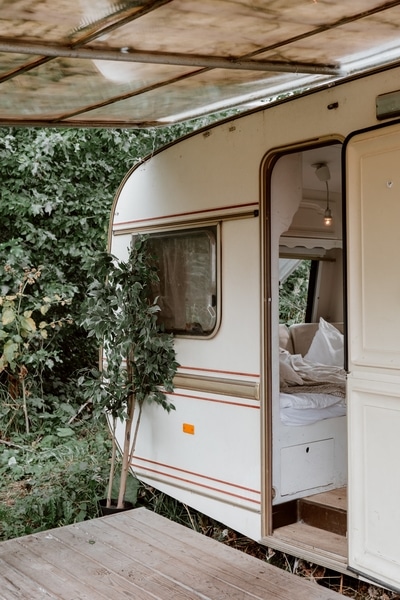 camper trailer in woods